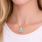 Silver tear drop pendant with a Turquoise cubic zirconia stone