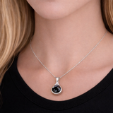Silver tear drop pendant with a black cubic zirconia stone